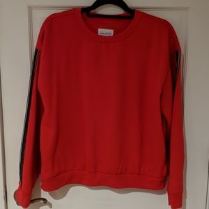 Cropped red sweater with black and white stripe